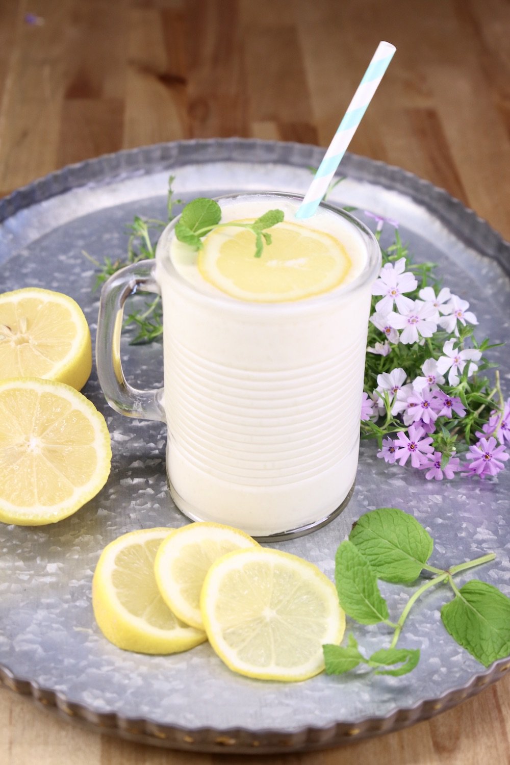frosted pineapple lemonade in a glass on a tray