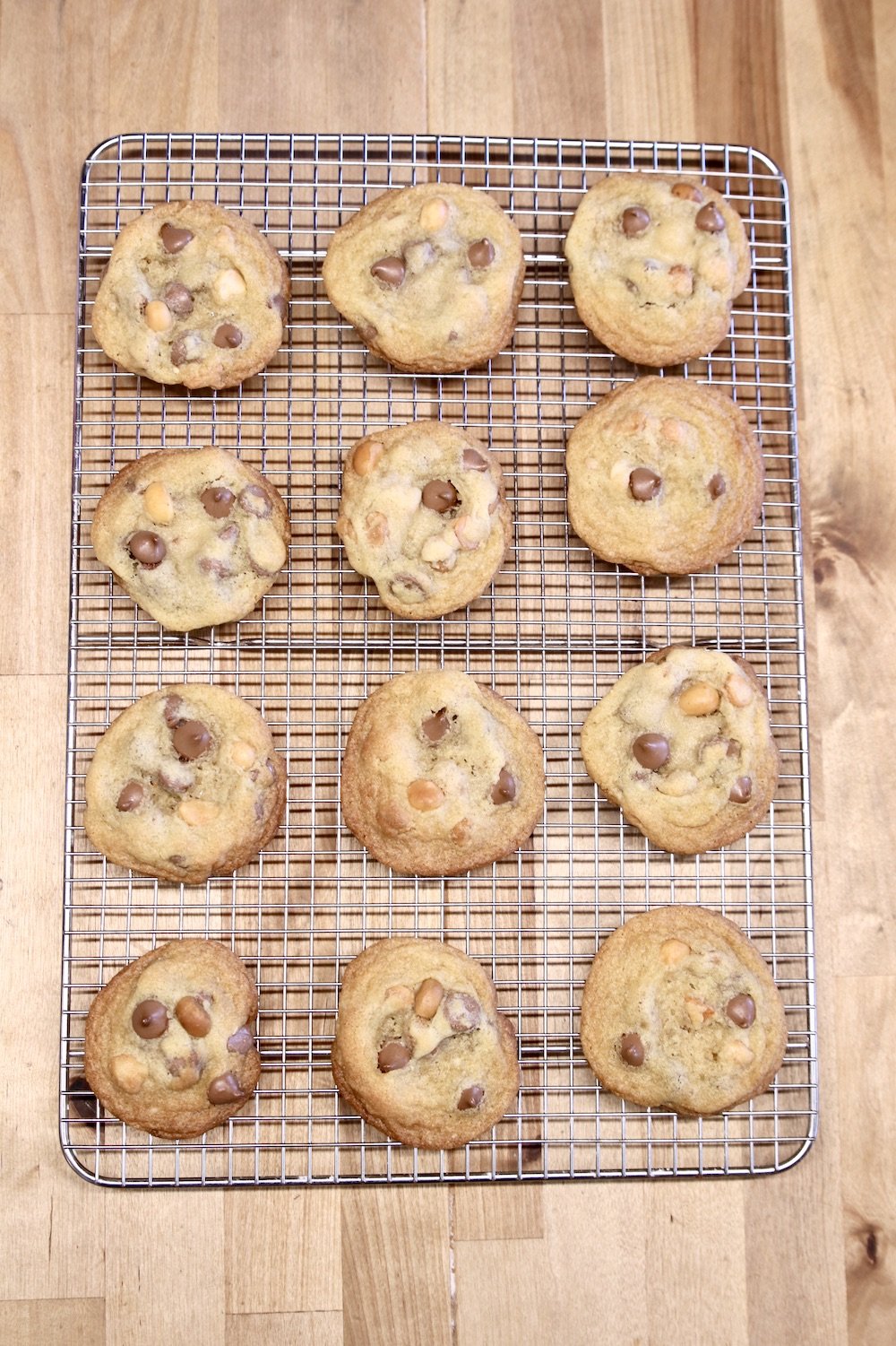 wire rack of baked chocolate chip cookies