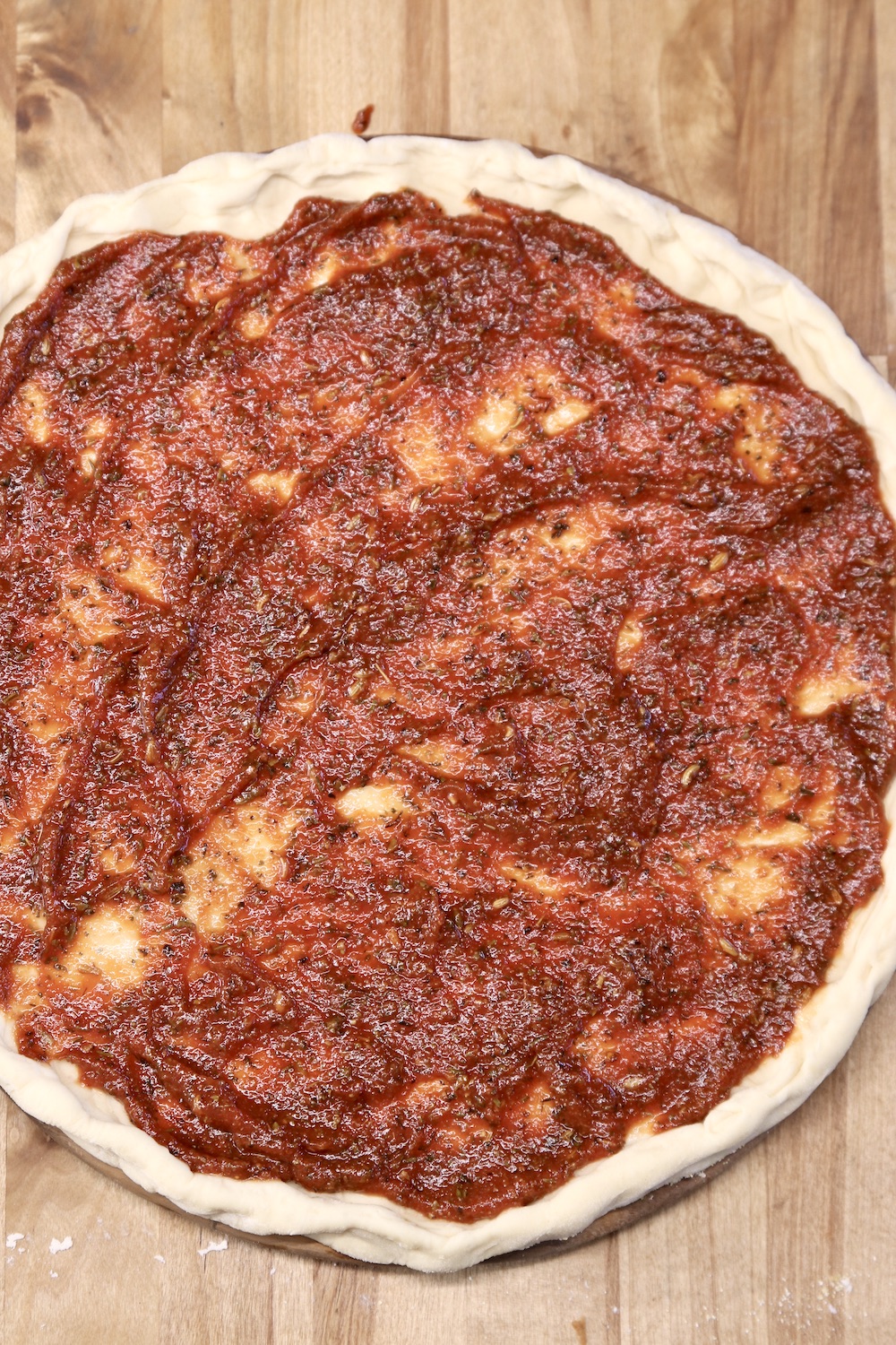 pizza dough with sauce