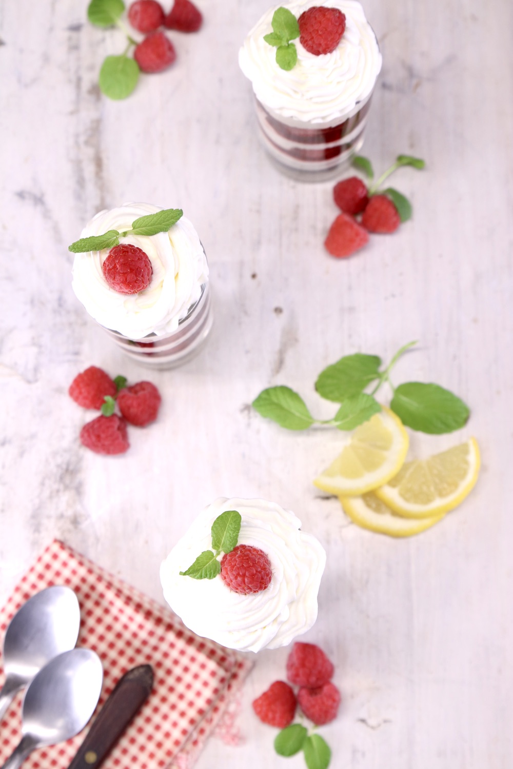 overhead view of individual servings of raspberry cheesecakes