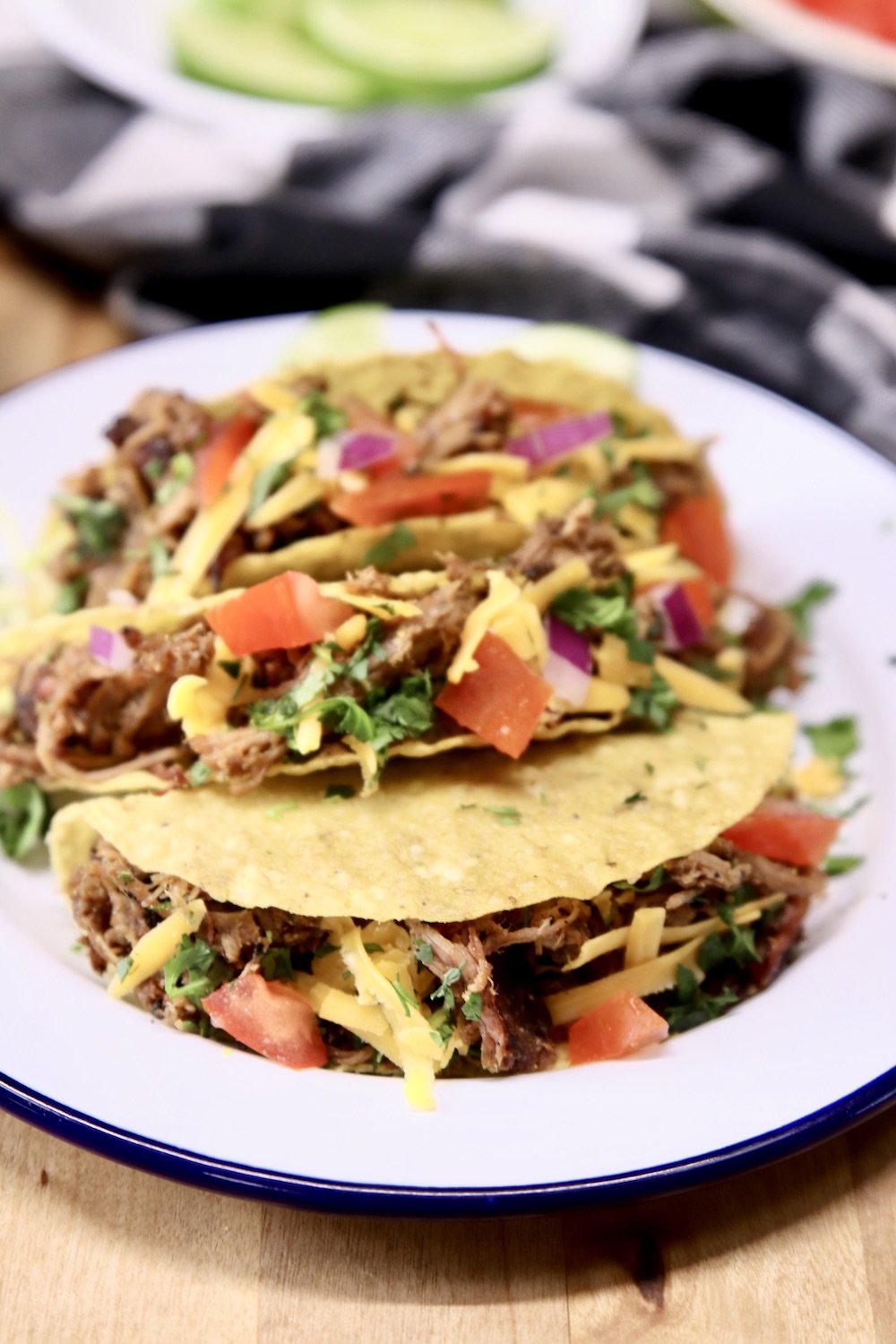 smoked pork tacos with tomatoes and cheese