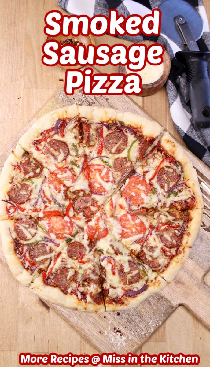 smoked sausage pizza on a cutting board - text overlay