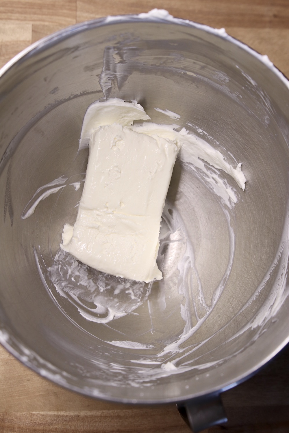 cream cheese block in a mixing bowl
