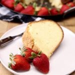 slice of Amaretto pound cake with strawberries on a plate