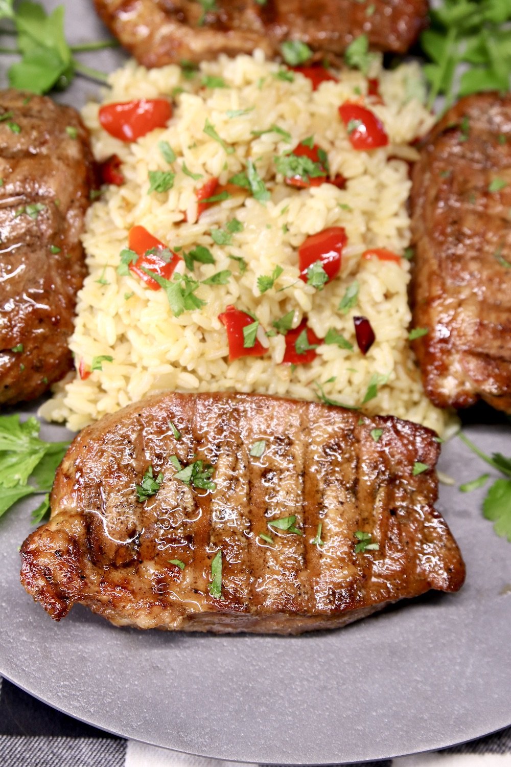 Asian Pork Chops with rice on a platter
