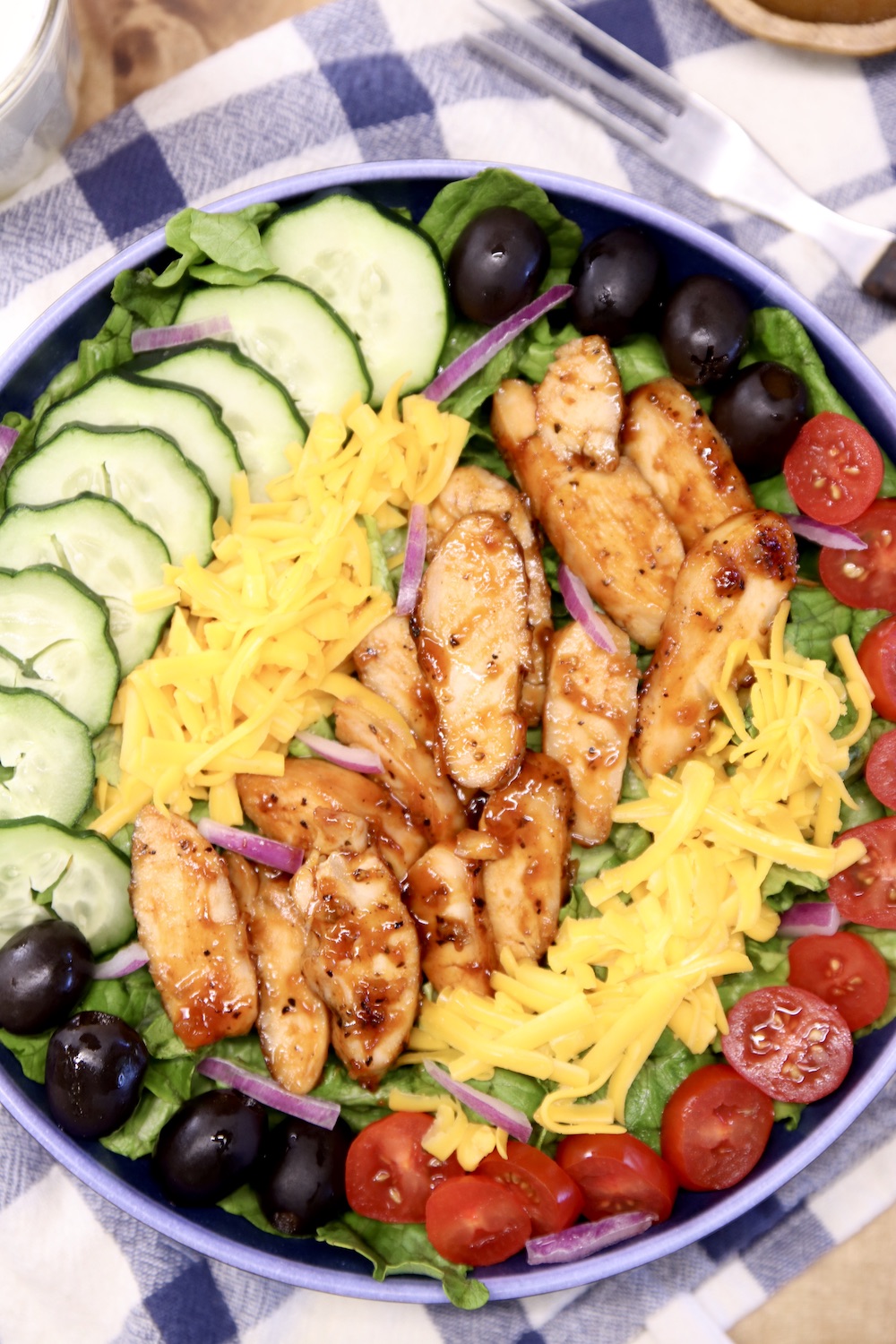 main dish chicken salad with lettuce, tomato, cucumber