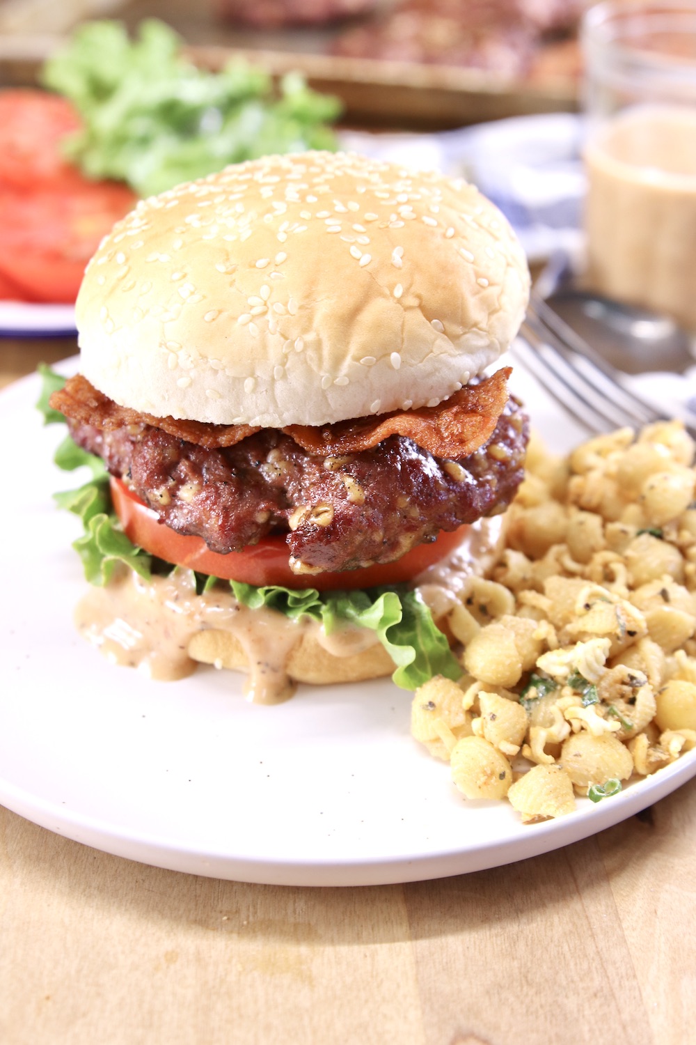 Burger on a plate with pasta salad