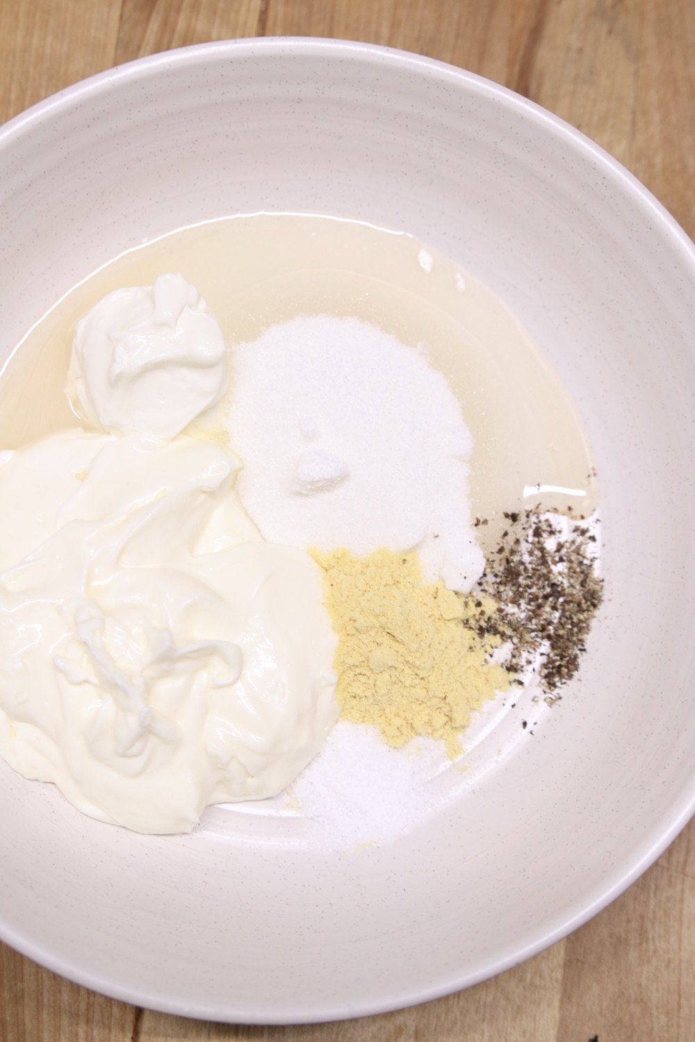 bowl of slaw dressing ingredients