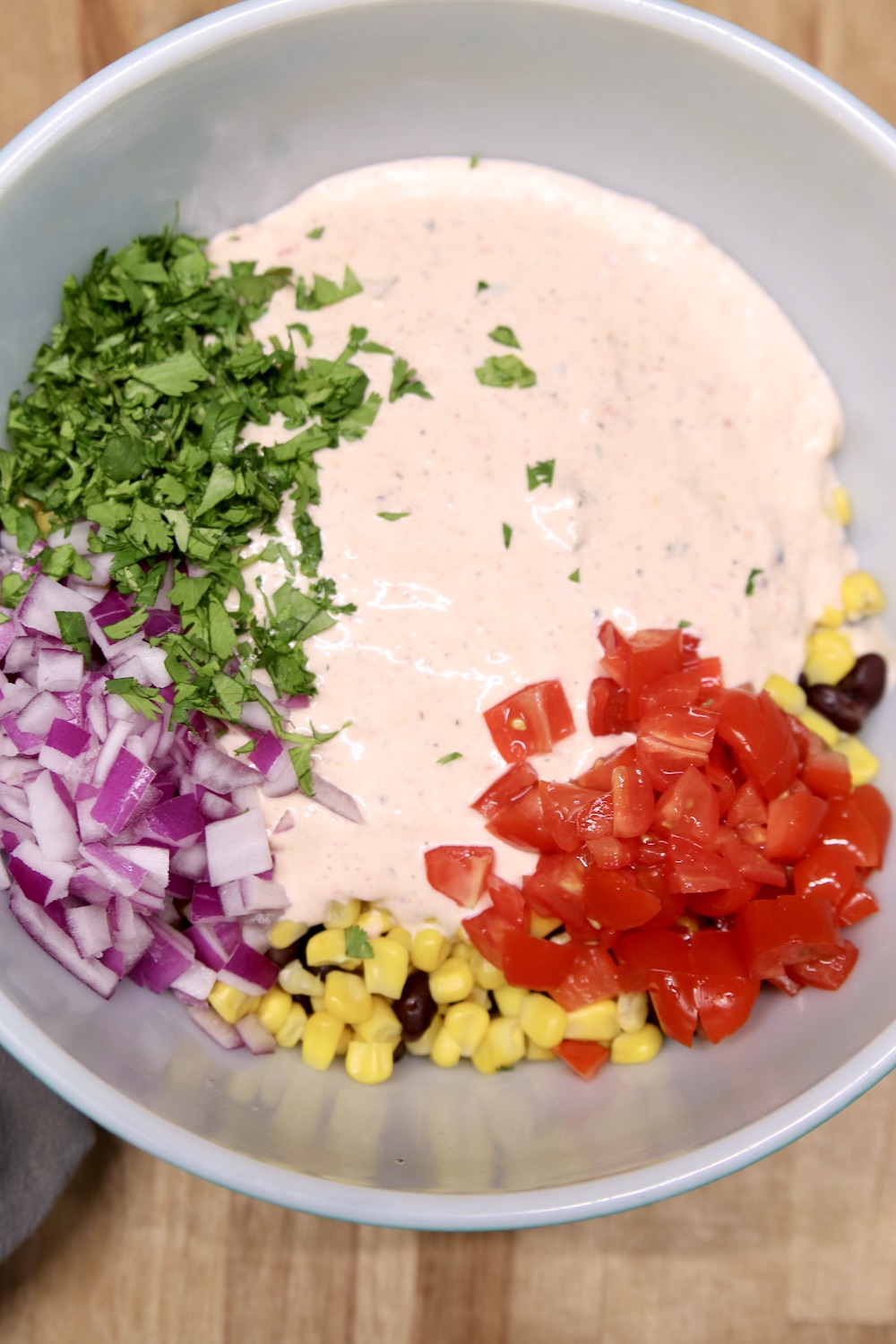 dressing and vegetables for black bean salad