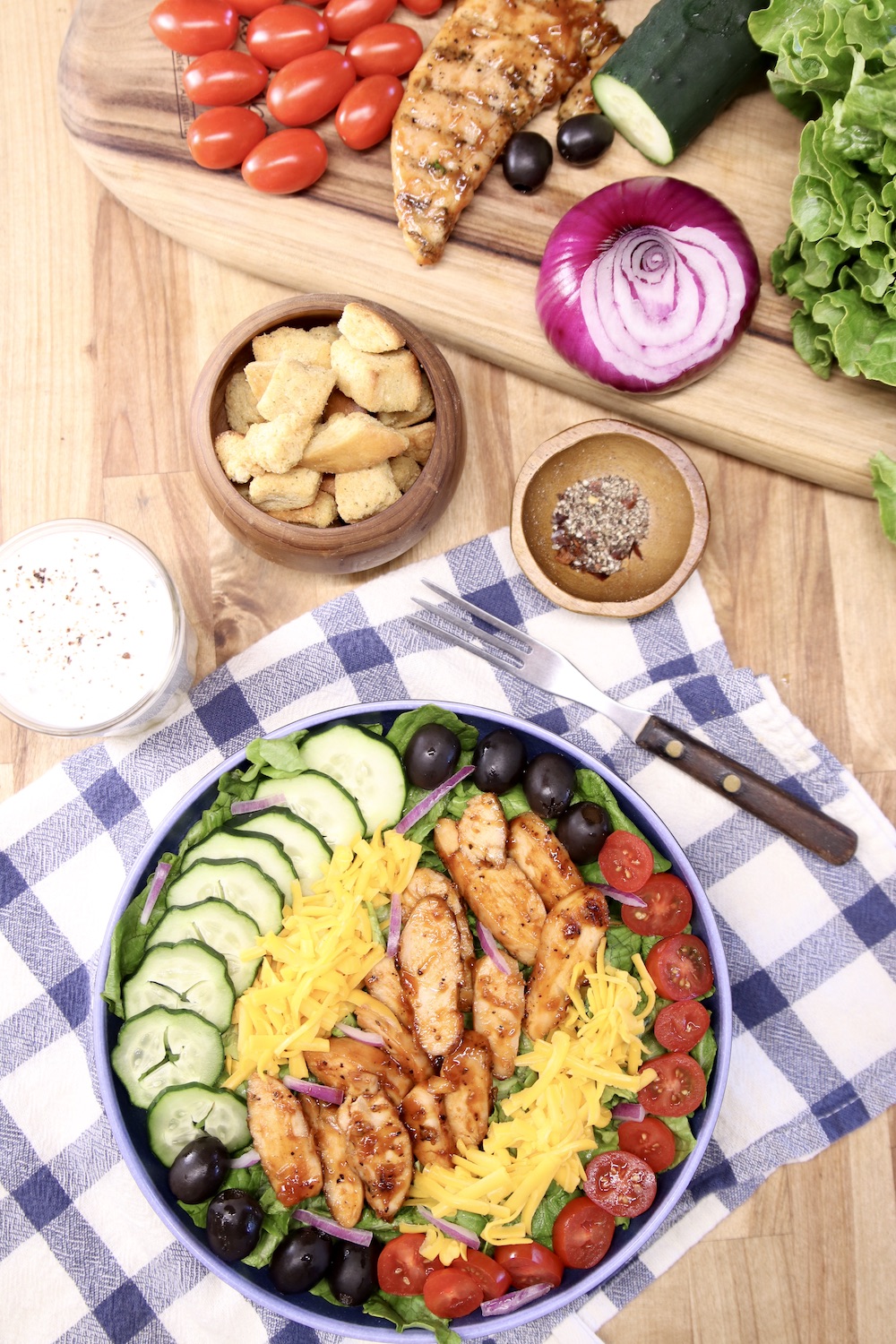 salad with cucumbers, tomatoes, bbq chicken slices