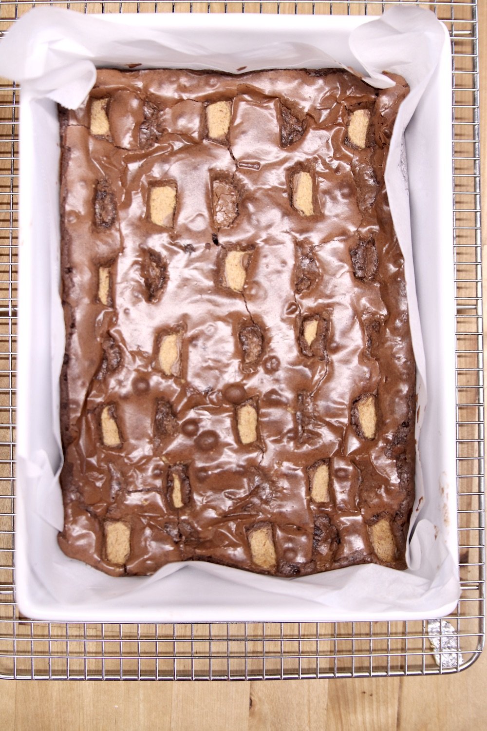 brownies topped with peanut butter cups, cut in half
