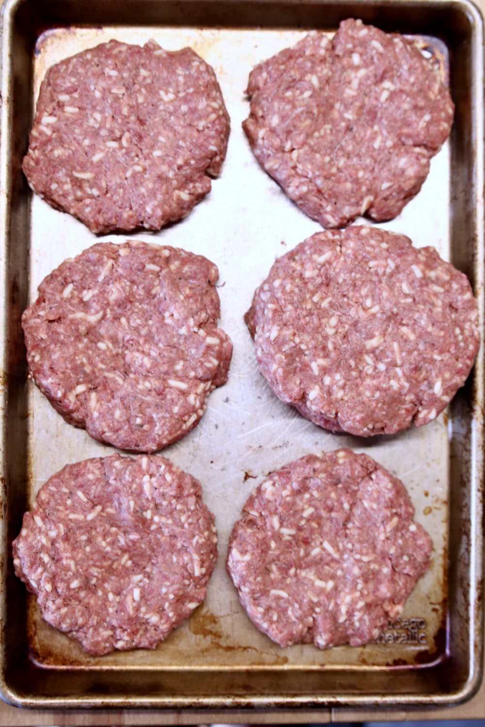Tray of hamburger patties for grilling