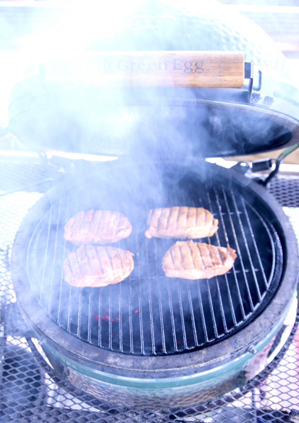 pork chops on a big green egg with smoke