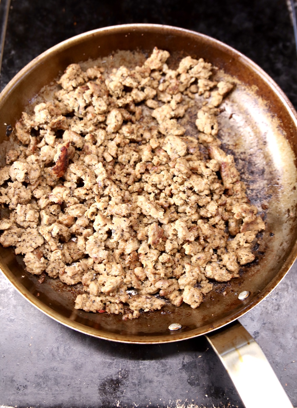 browned sausage in a skillet