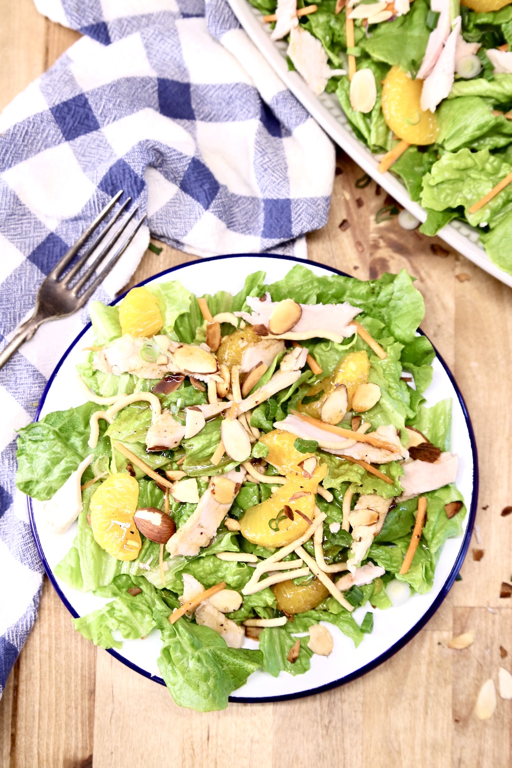 plate of salad with oranges and chicken