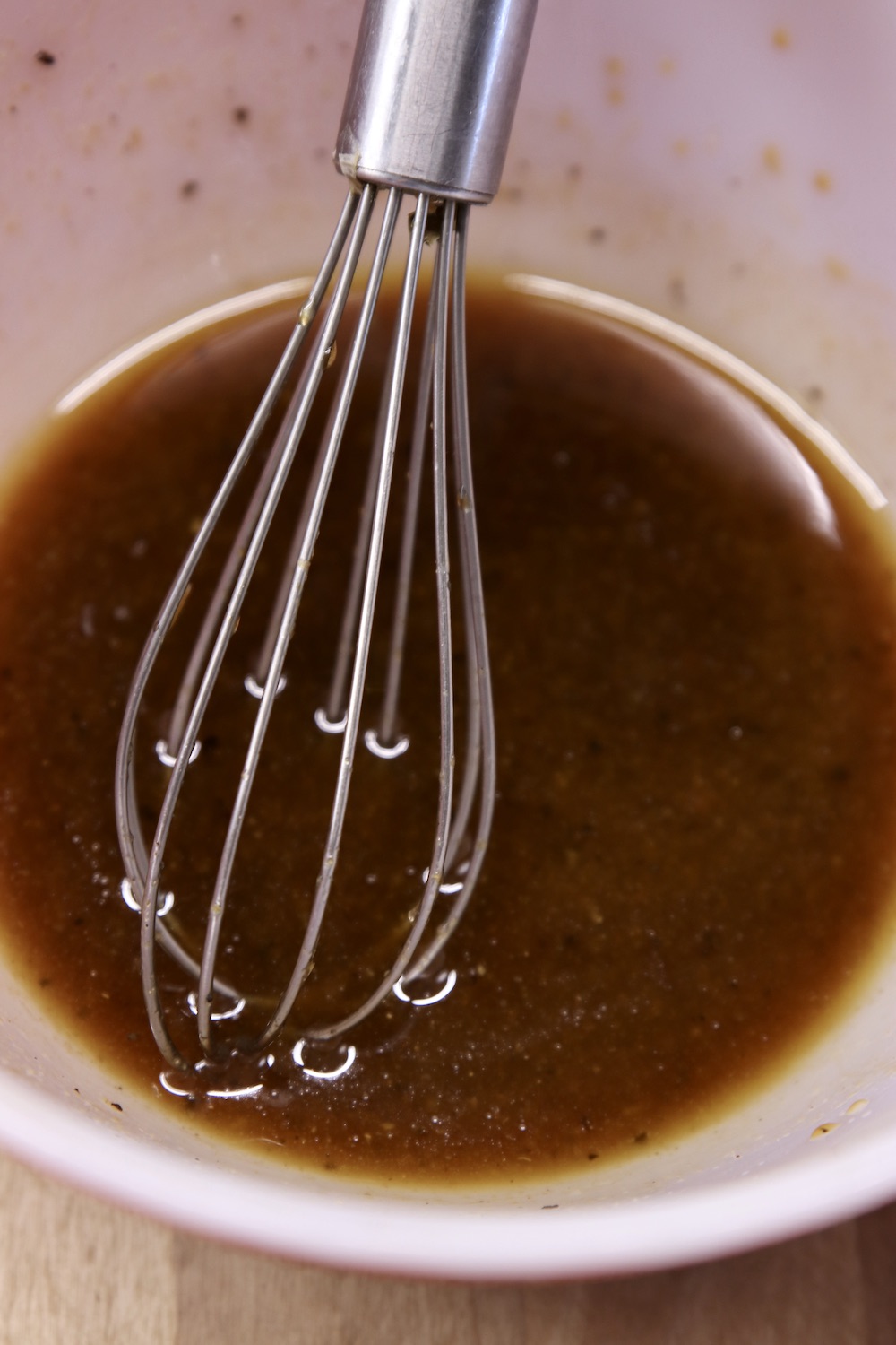 bowl with a whisk with Sesame Dressing