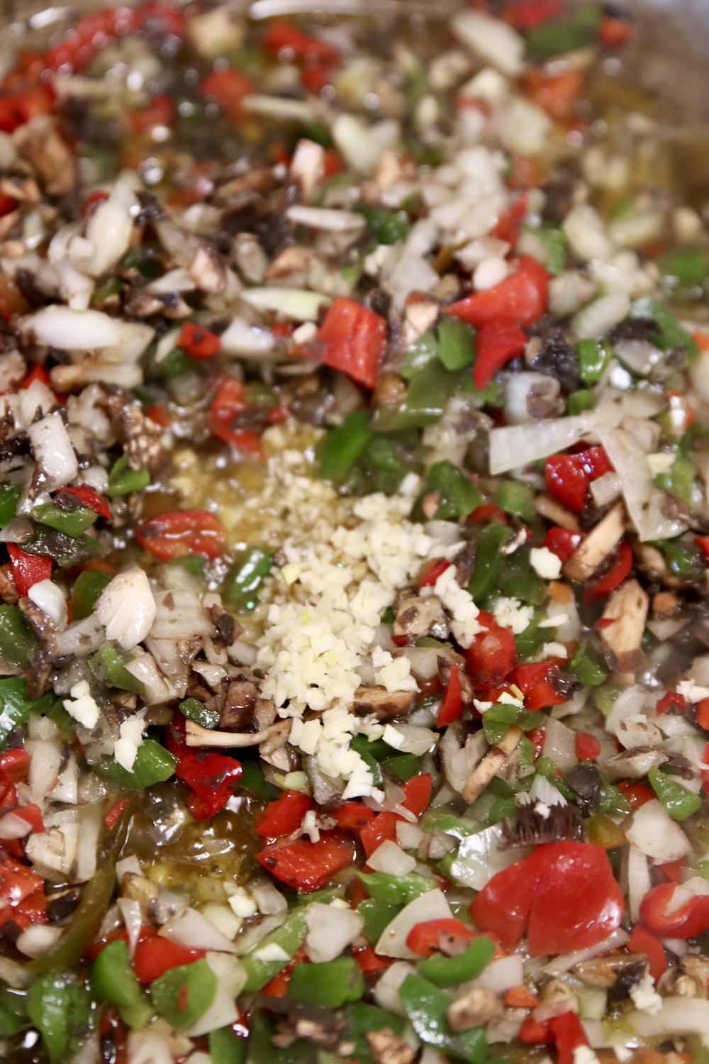 diced peppers, onions garlic in a skillet