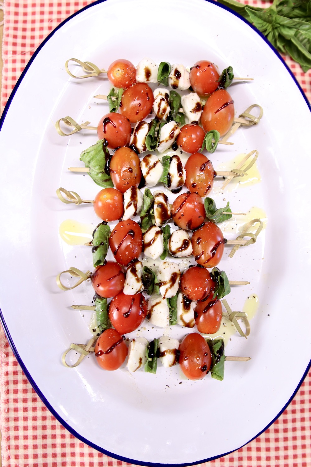 Caprese Appetizer Skewers on an oval platter