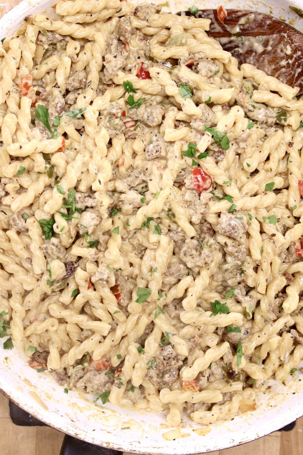 Italian Sausage Pasta in a skillet with bell peppers