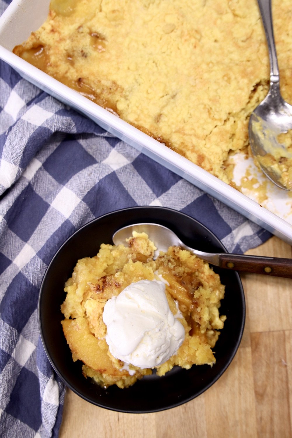 Peach Dump Cake with Vanilla ice cream overhead view