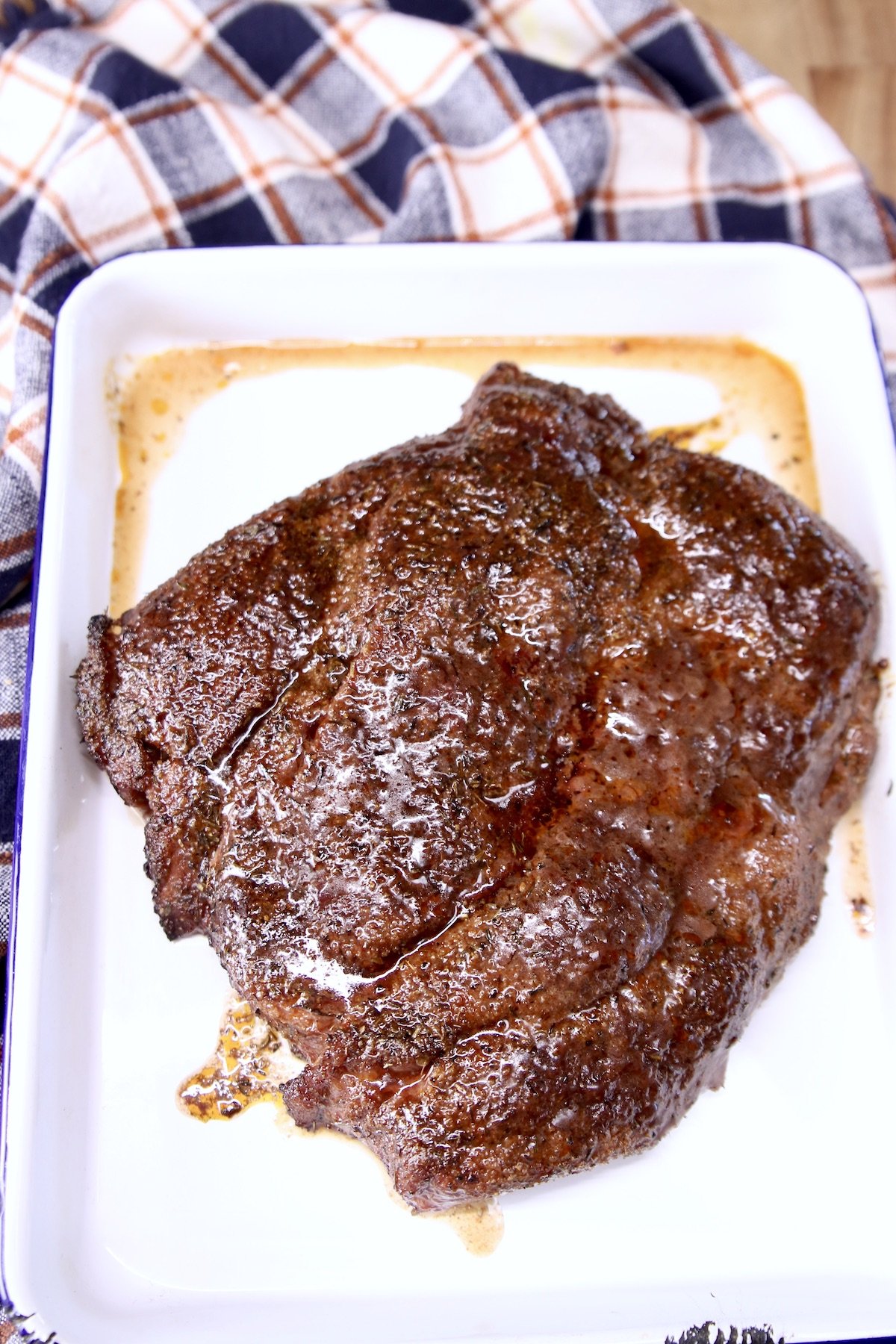 chuck roast on a pan resting before slicing
