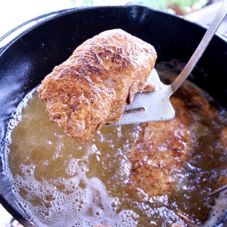 fried pork chop on a spatula