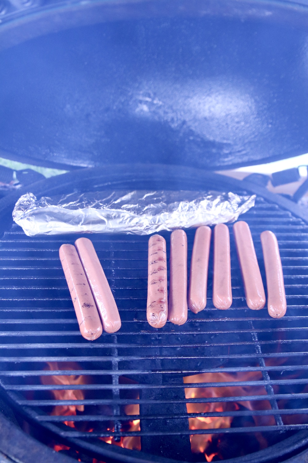 hot dogs on a grill