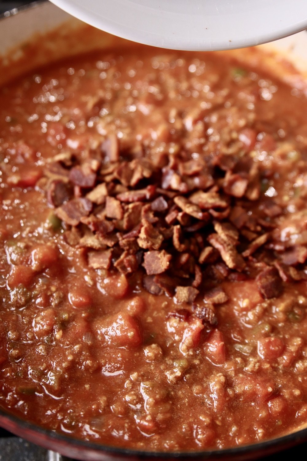 Crispy bacon added to hot dog chili