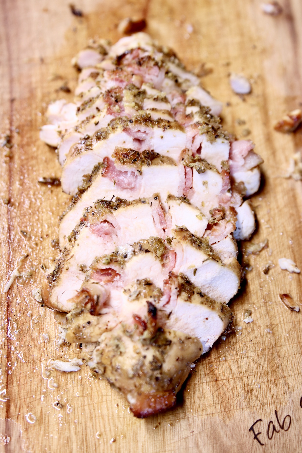 sliced chicken breast on a cutting board