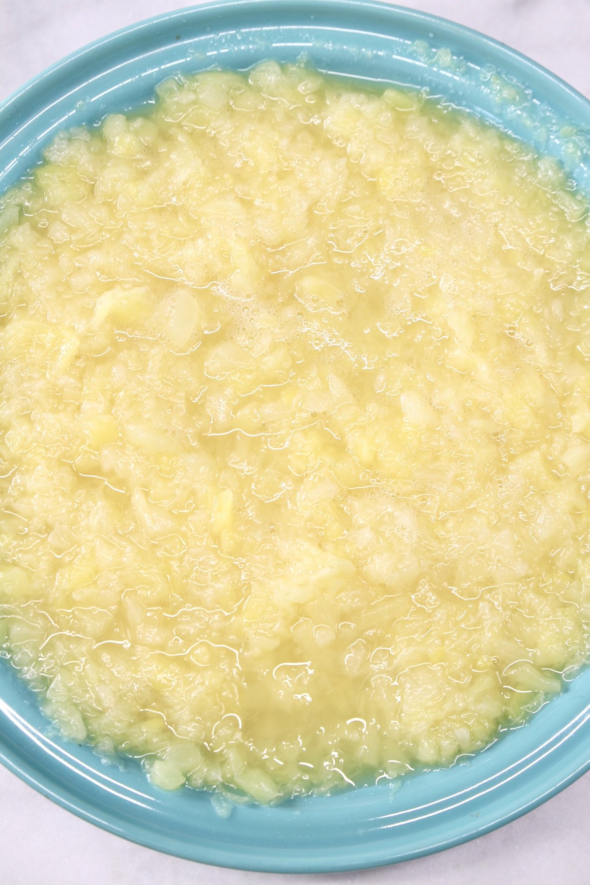 crushed pineapple in a blue pie plate
