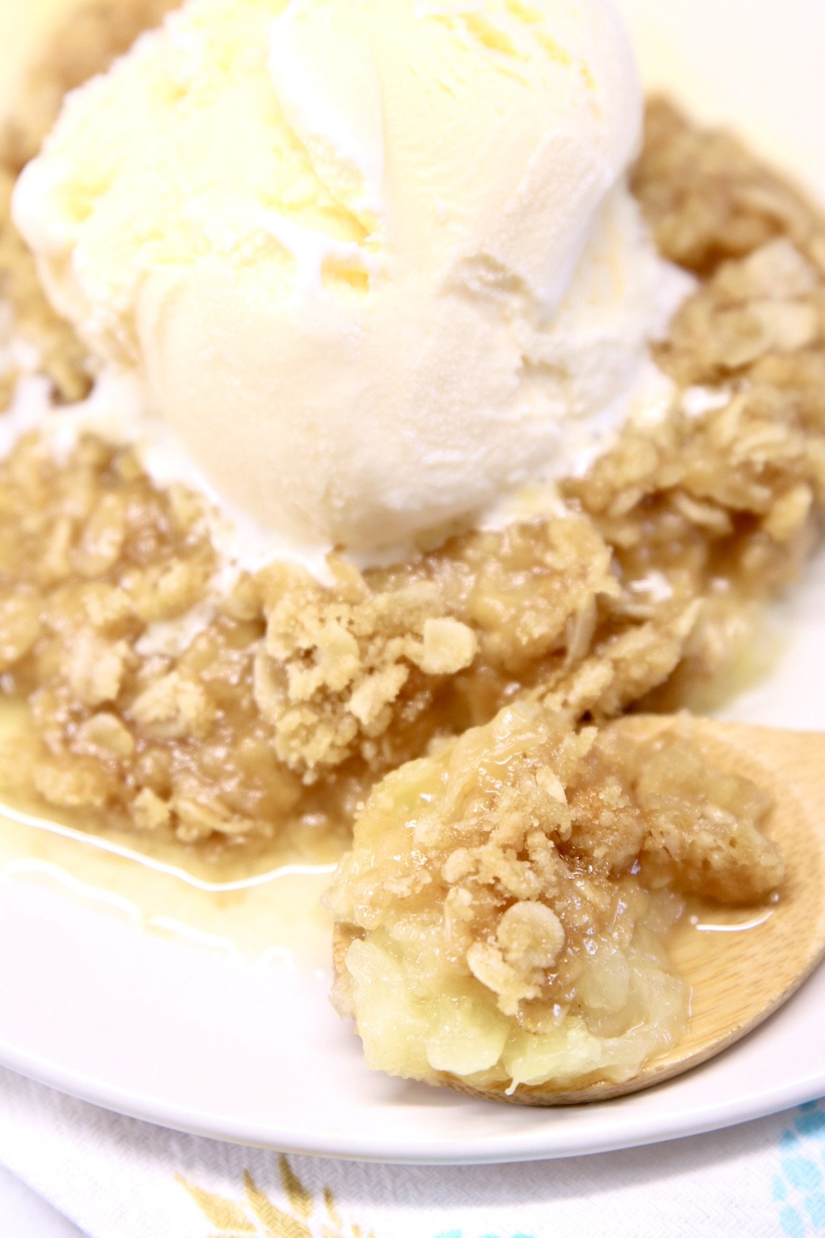 Vanilla ice cream served over pineapple crisp 