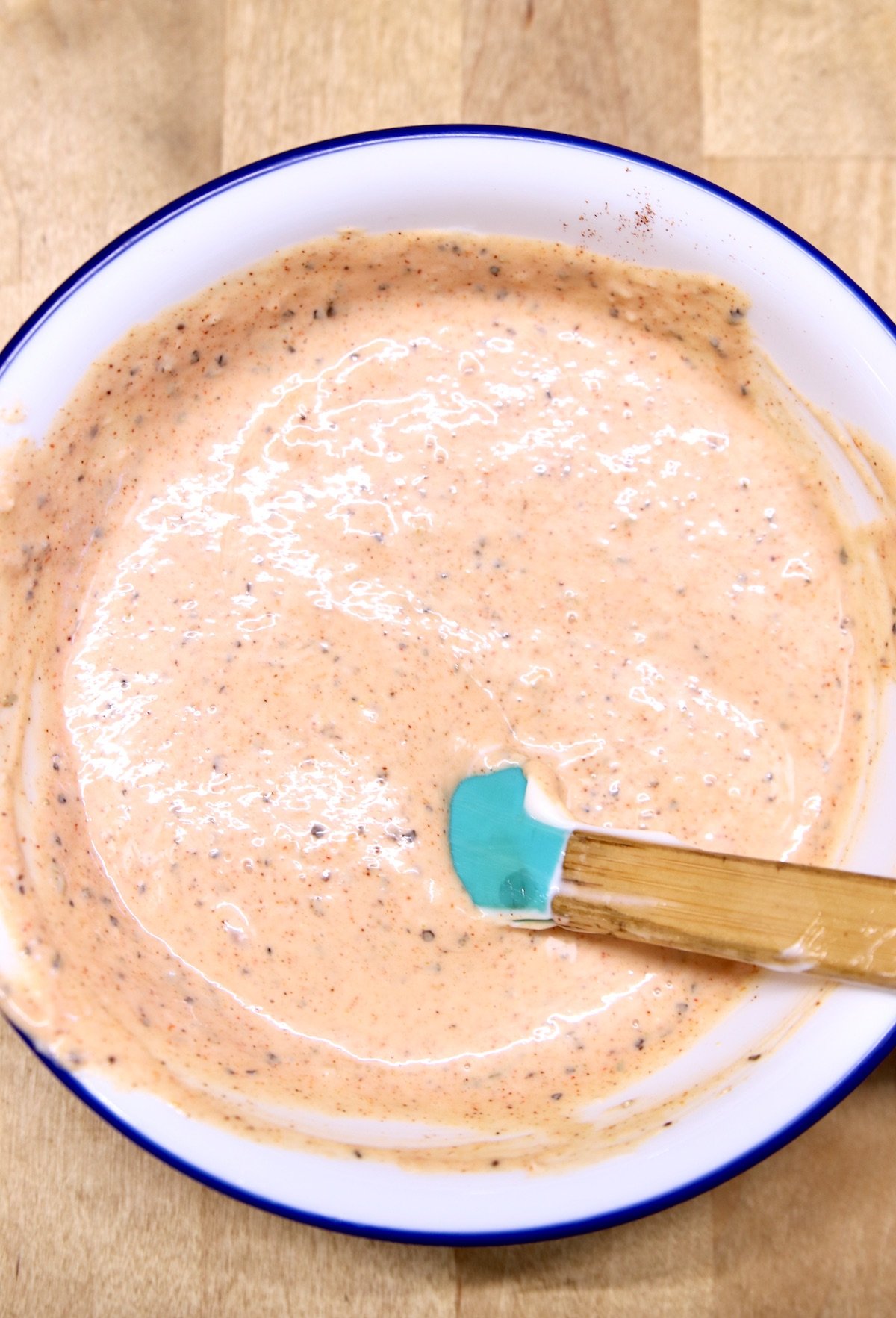 bowl of blooming onion sauce with a small spatula