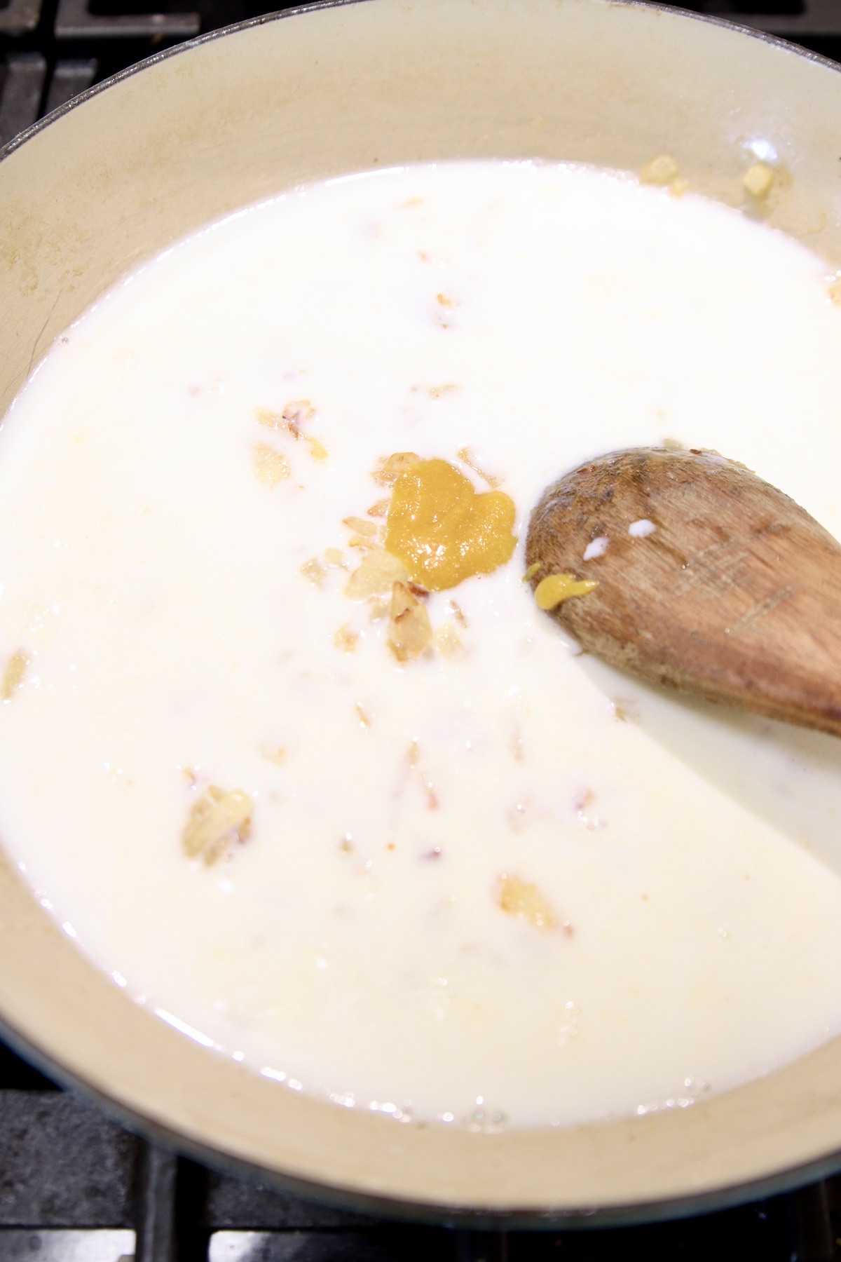 pan with milk and chicken base to make sauce for pasta