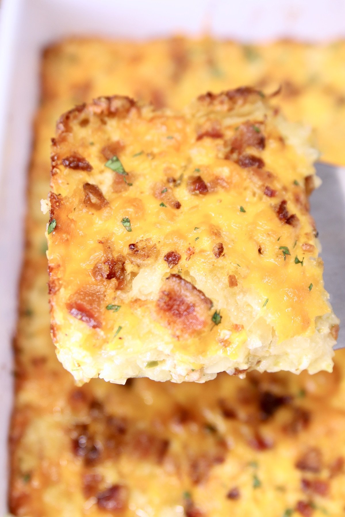 Bacon Hashbrown Casserole - serving from spatula