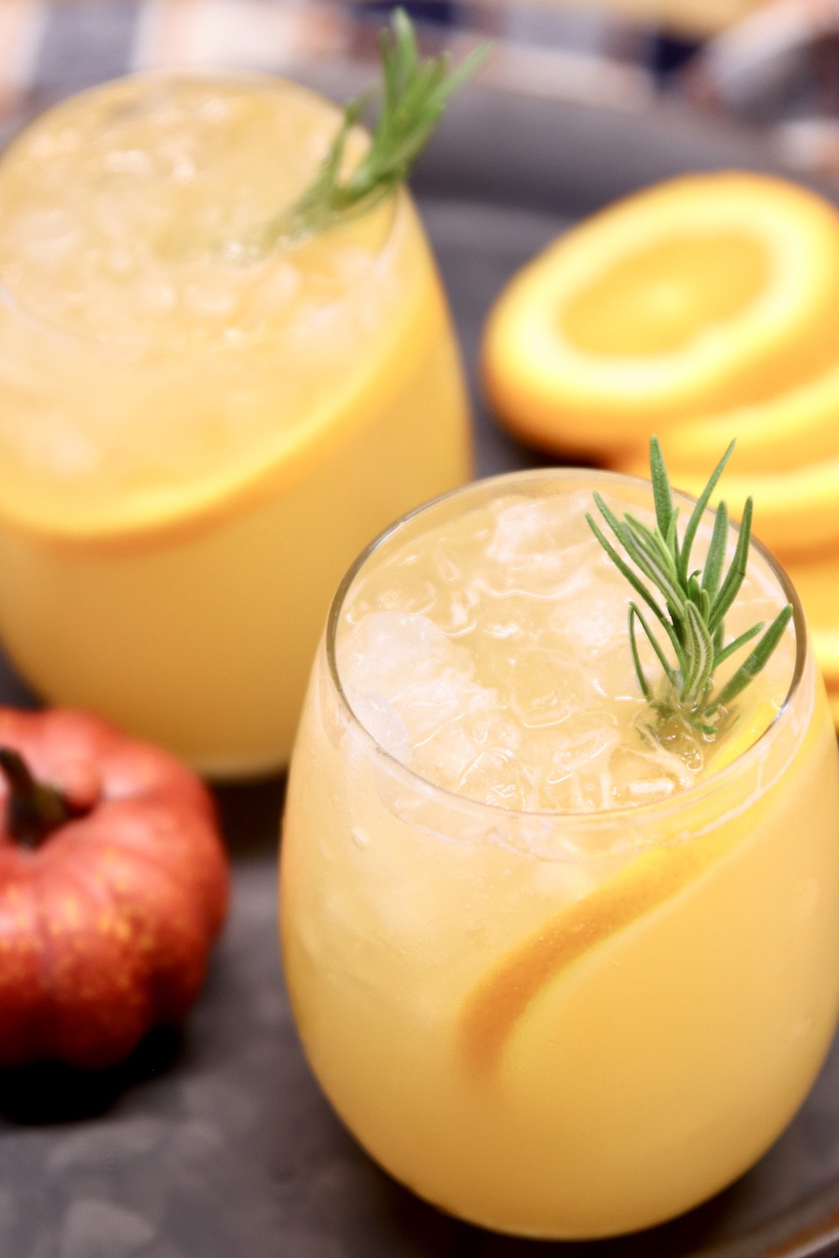 2 stemless wine glasses with harvest punch cocktail