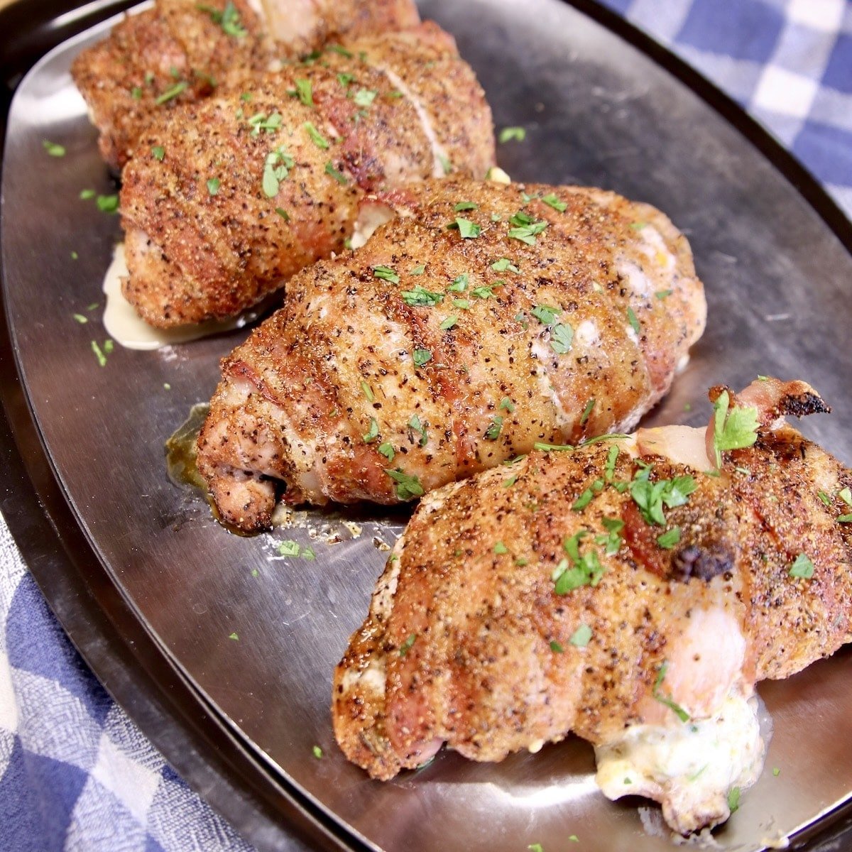 Grilled pork chops with bacon and cream cheese filling.