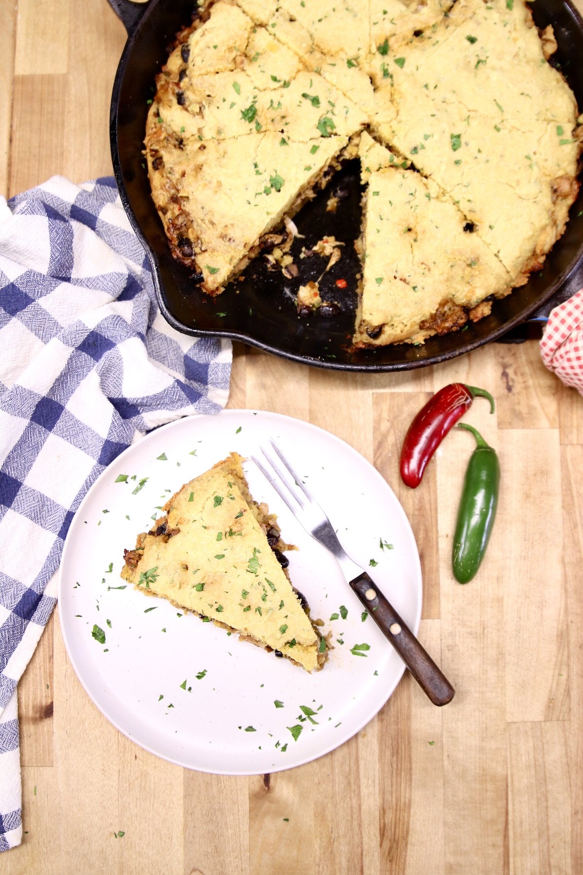 cornbread skillet casserole overhead view - skillet & plated slice