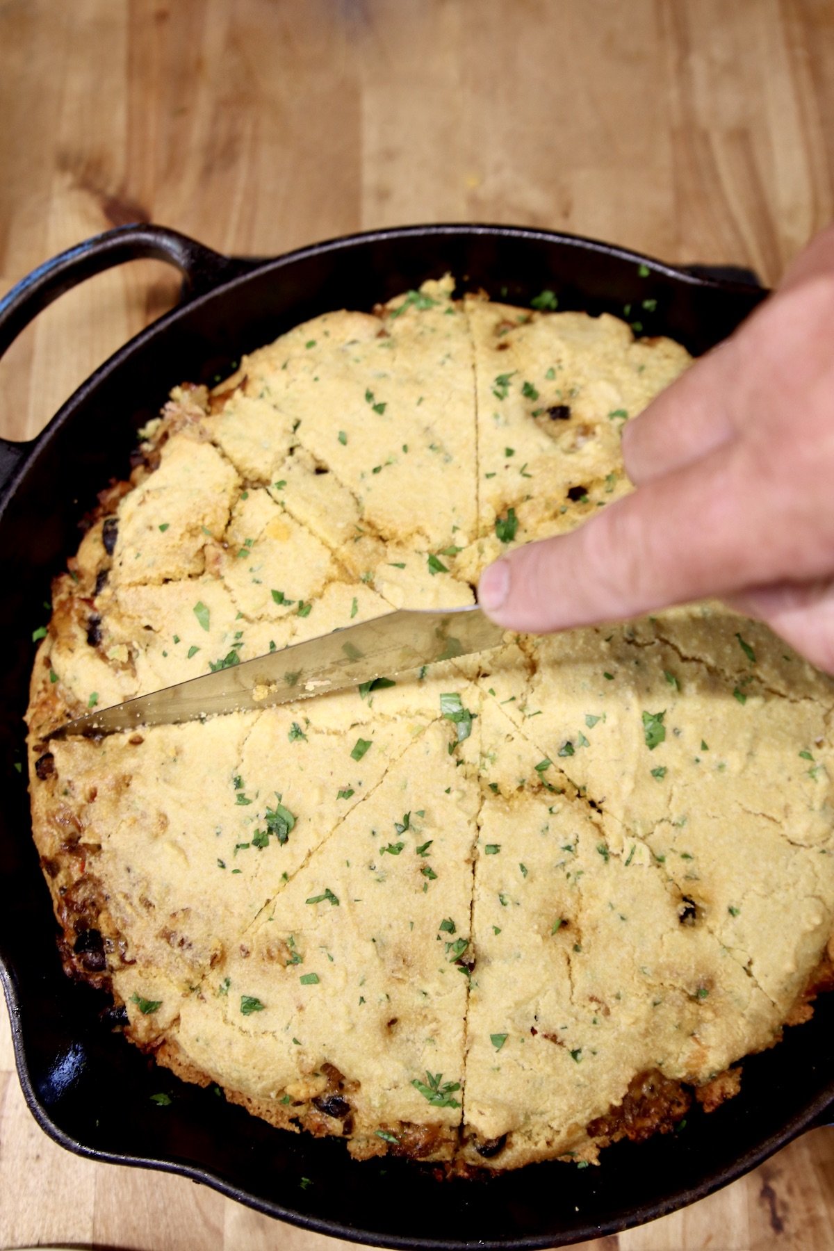 slicing Mexican cornbread