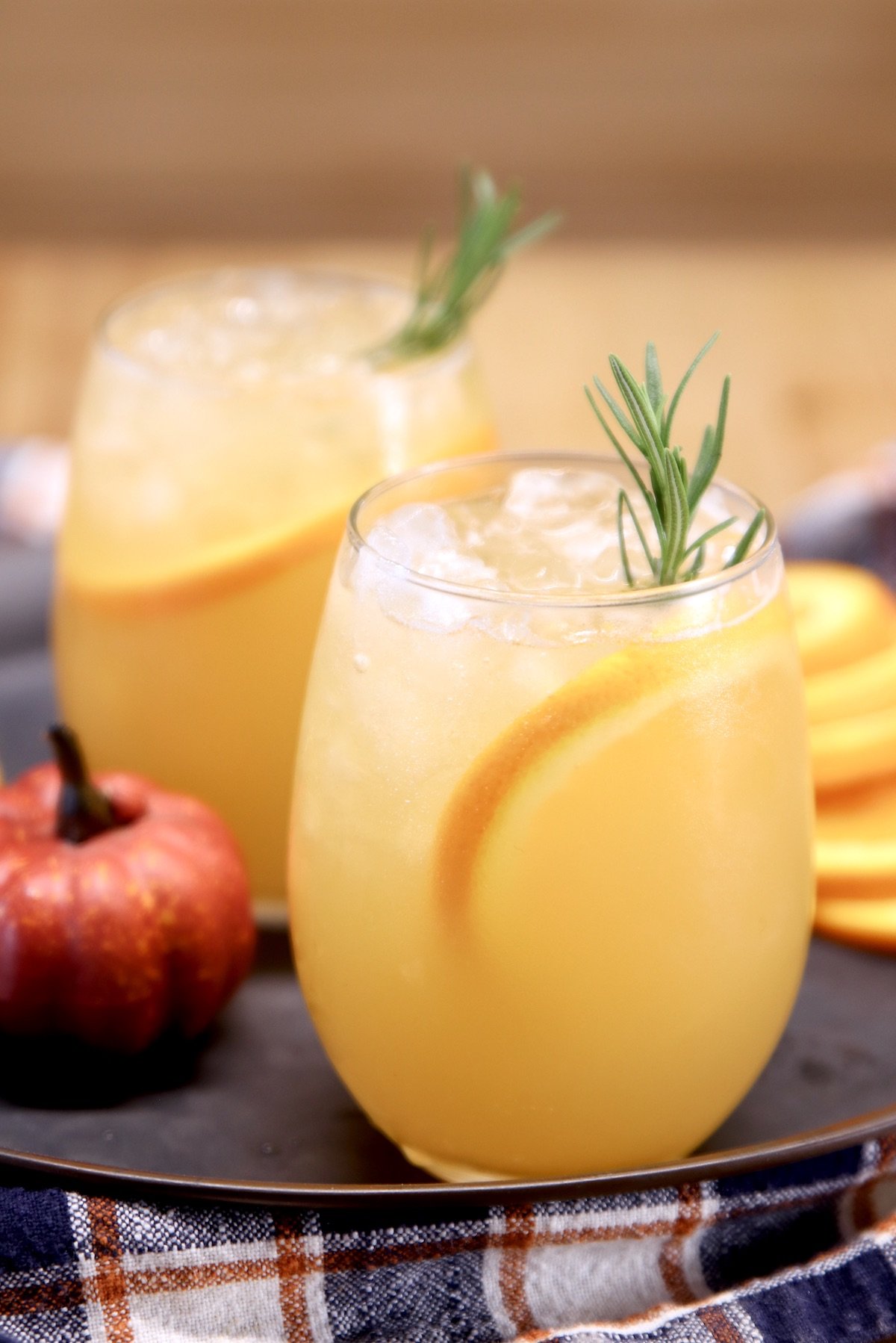 harvest punch cocktail in 2 stemless wine glasses
