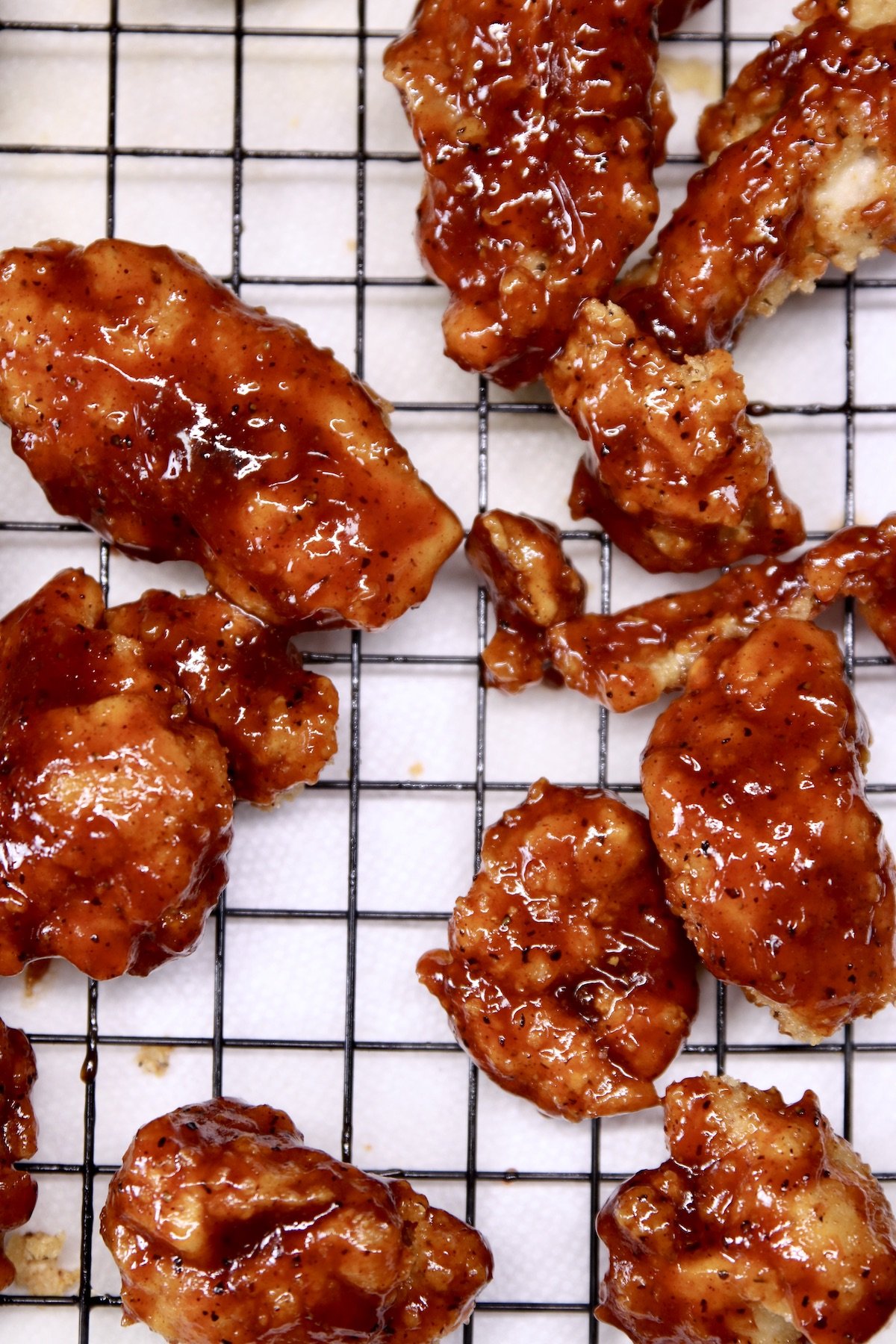 bbq boneless wings on a wire rack - closeup