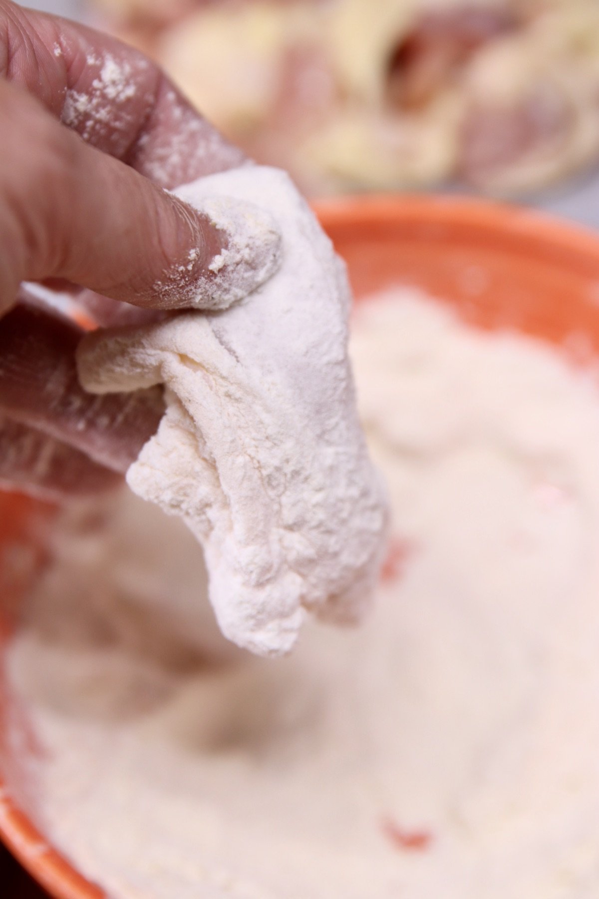 chicken piece dredged in flour