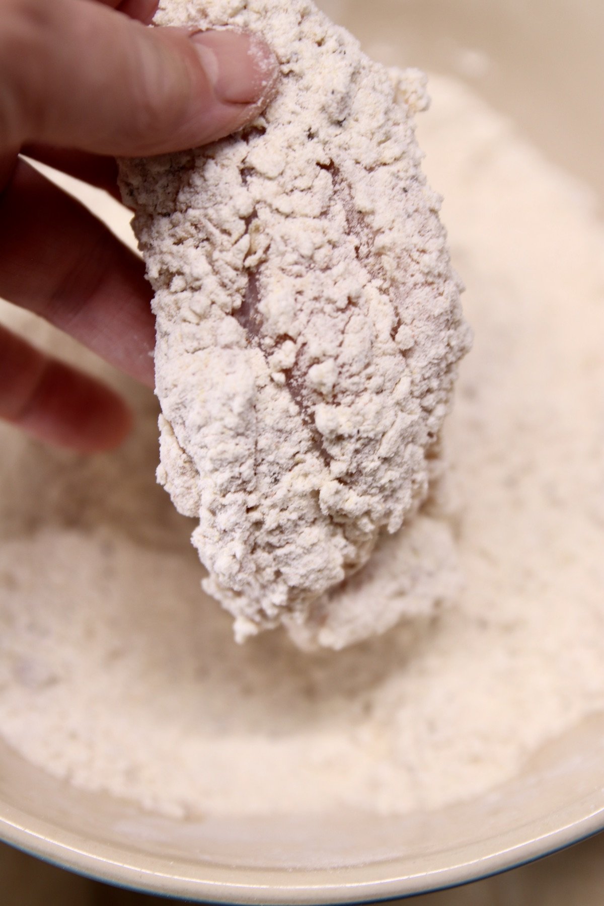 chicken piece dredged in flour