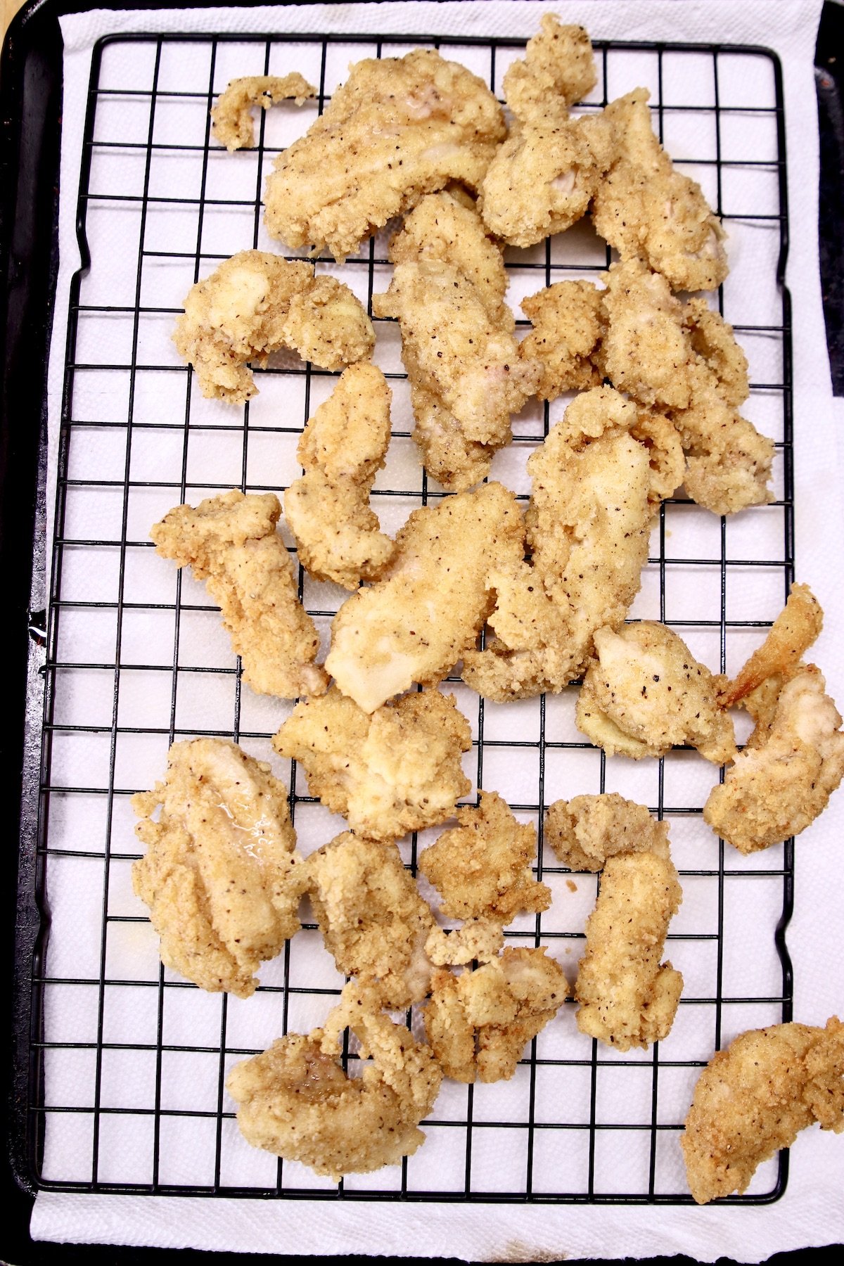 wire rack with fried boneless chicken