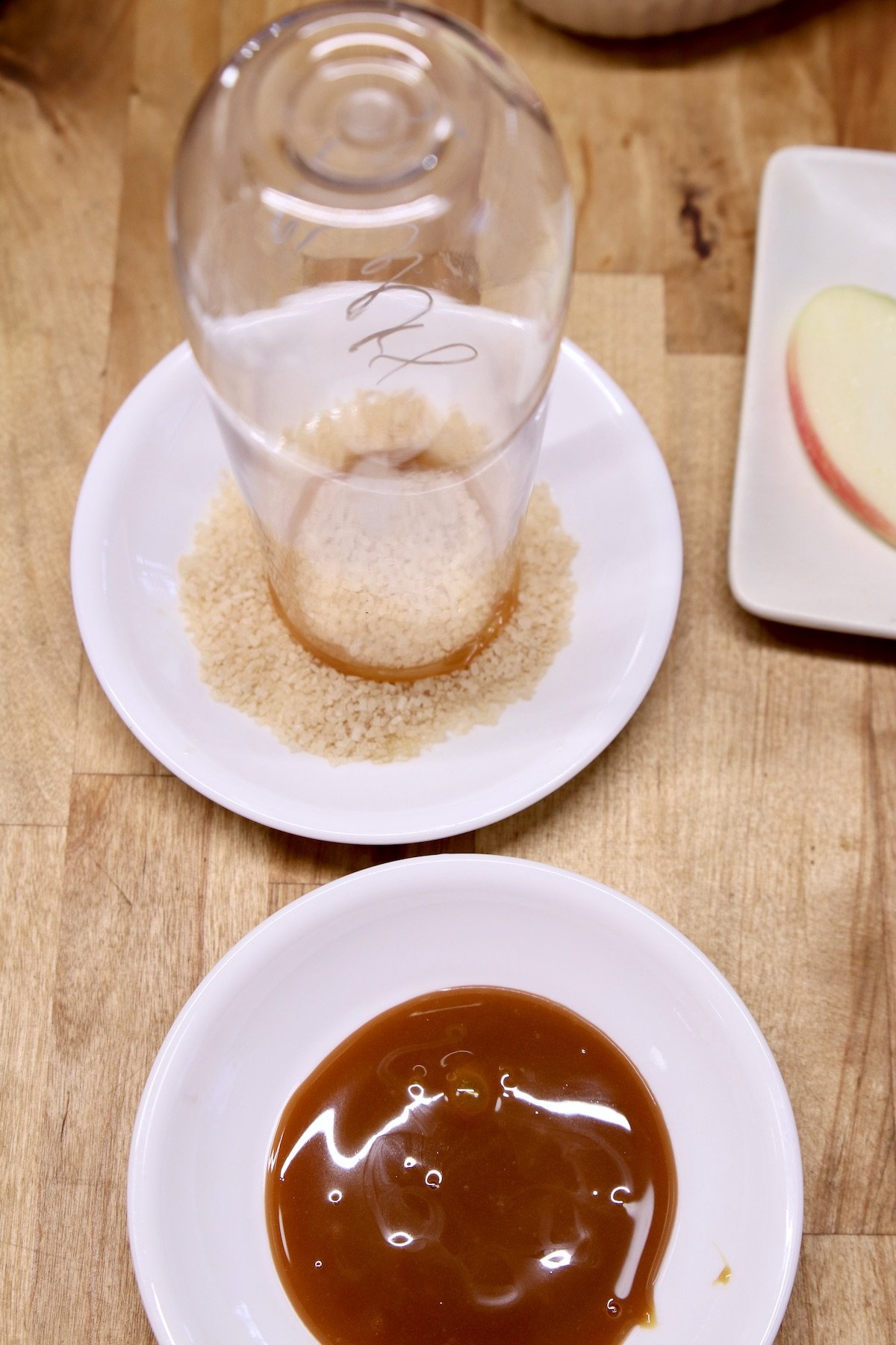 dipping champagne glass into coarse sugar for garnished rim