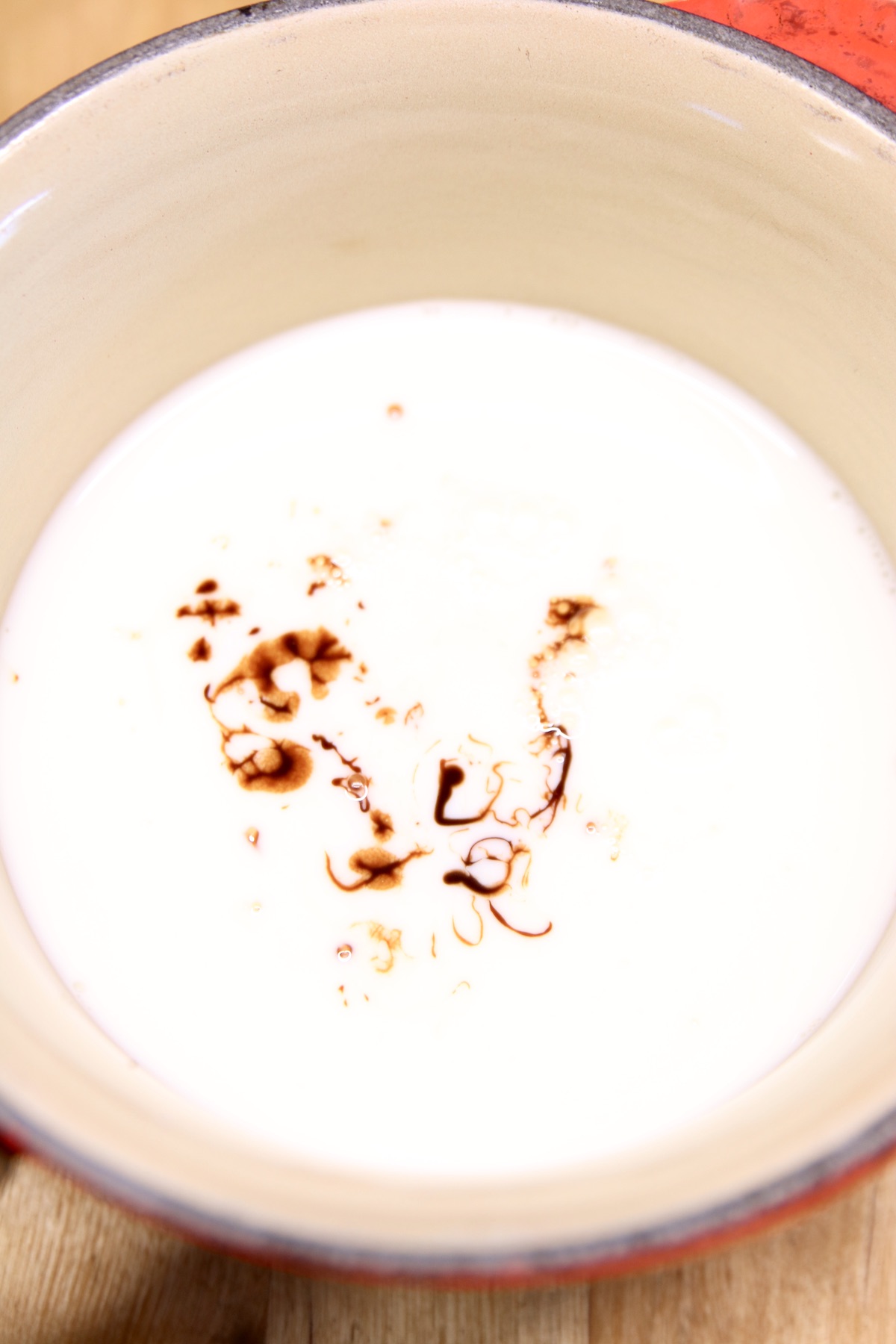 pan of milk and chocolate syrup