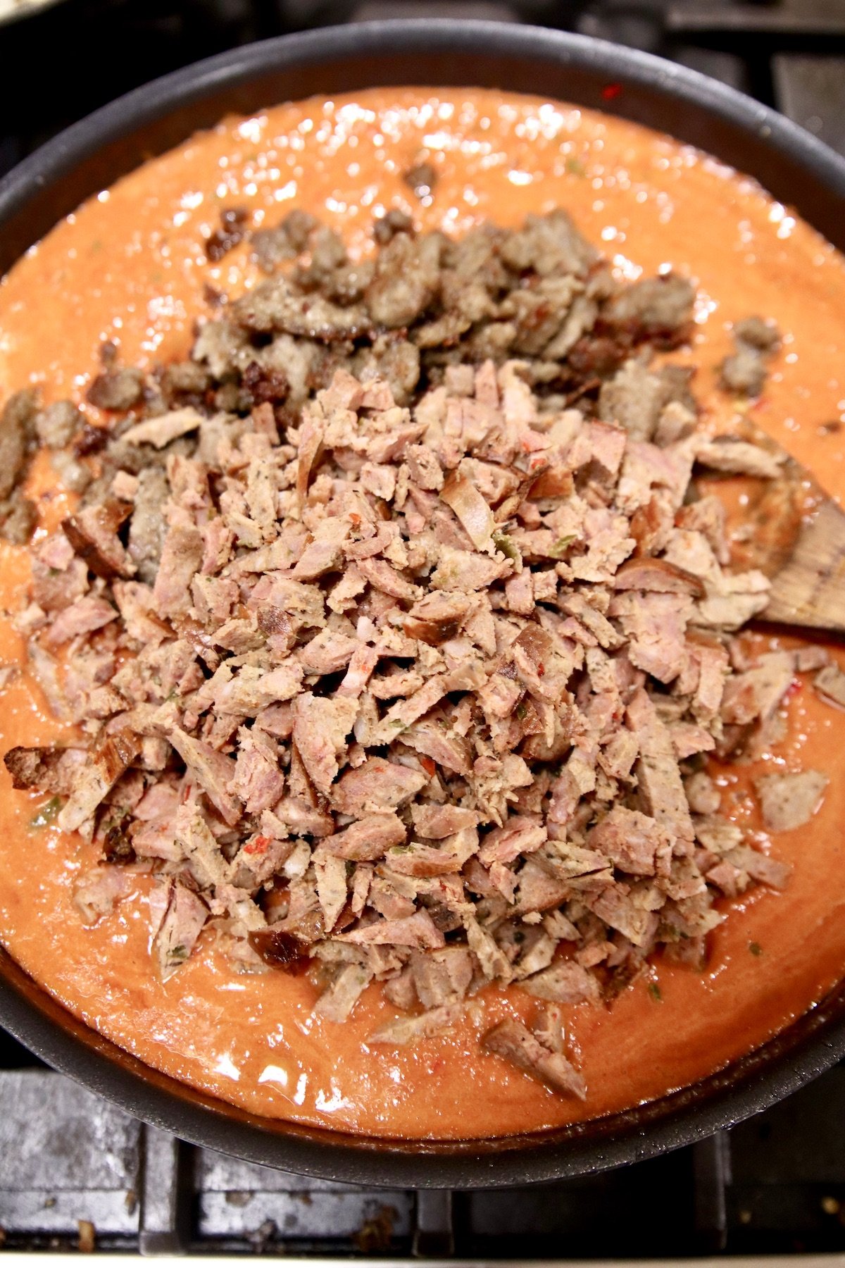 sausage added to tomato sauce