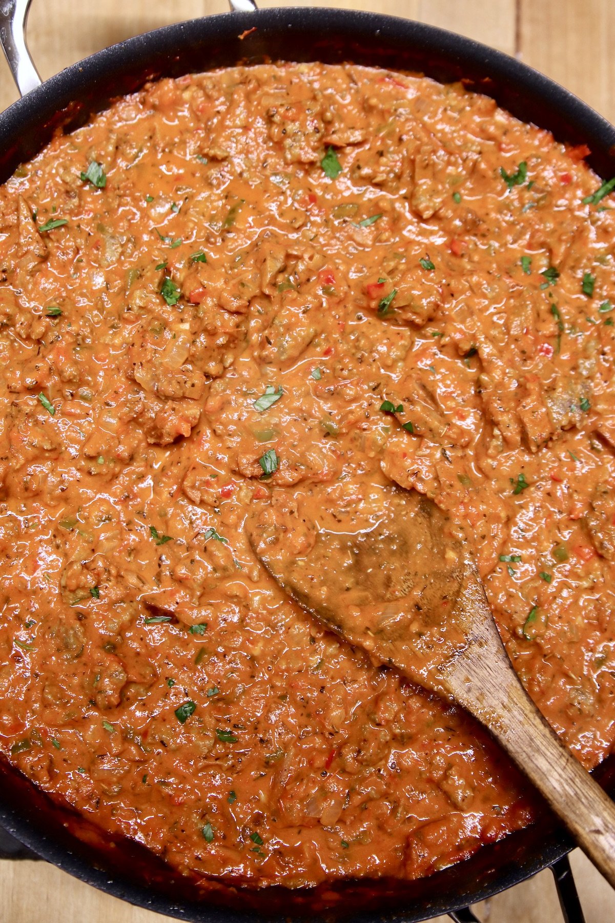Skillet with meat sauce - wooden spoon