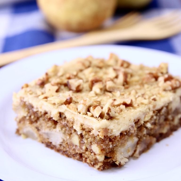 Pear Cake with brown sugar icing with walnuts - slice on a plate