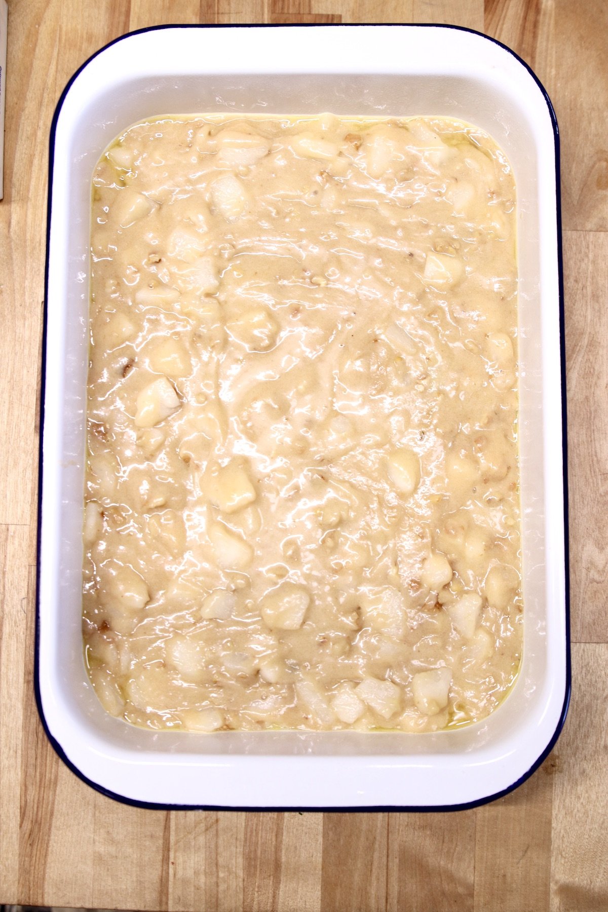 pear cake in a 9 x 13 pan ready to bake