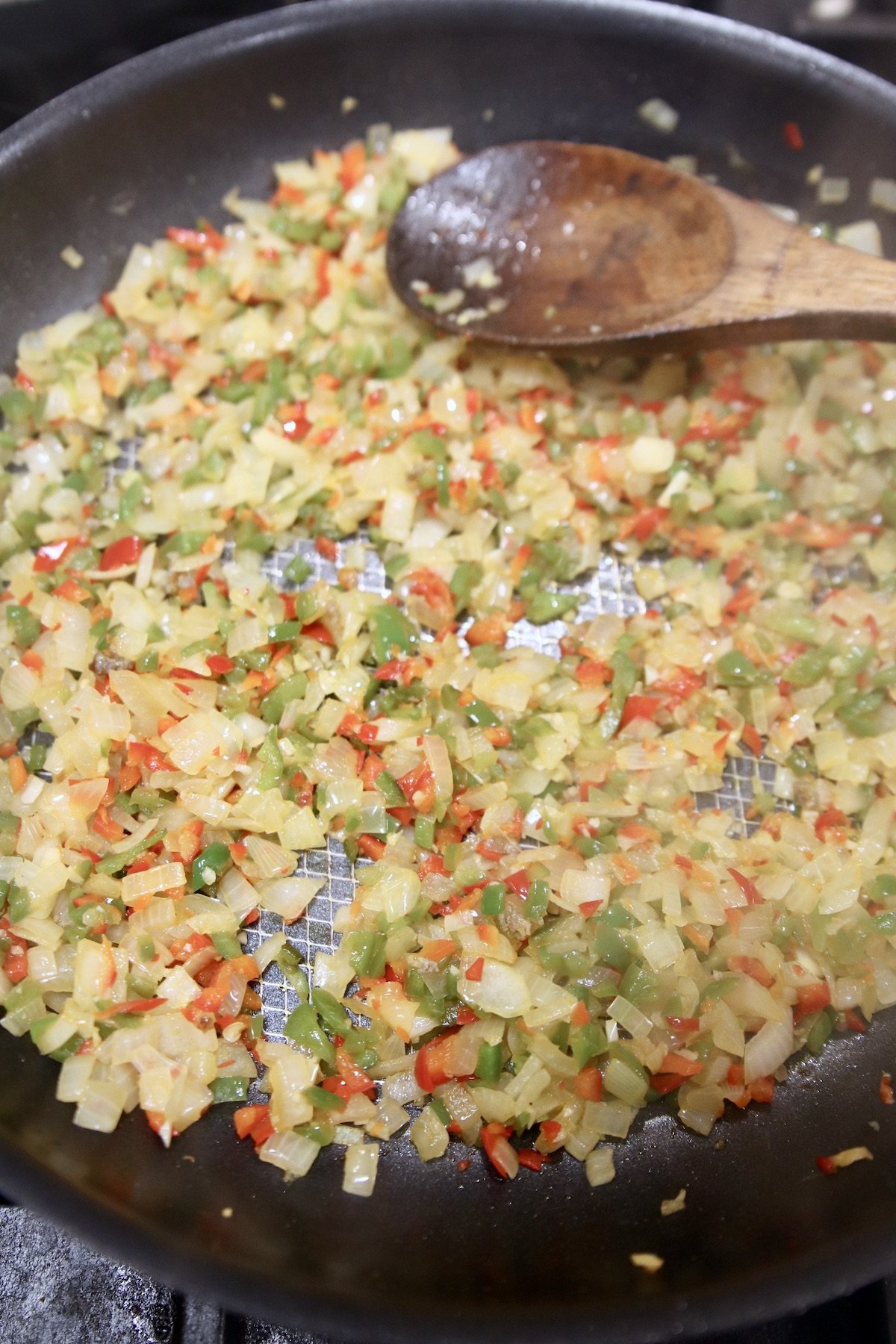 cooked vegetables in a skillet for meat sauce
